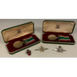 Medals - Two Women's Voluntary Service Medals, one with long service bar, each cased; similar pin