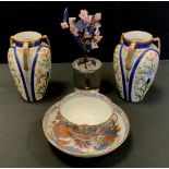 A pair of Noritake vases, 12.5cm high, c.1930; a New Hall tea bowl and saucer, tobacco leaf pattern,