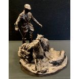 Heredities bronzed resin figure of a Shepherd with two sheep & dog, modelled by G Tikey, dated 1980,