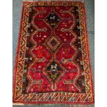 A South West Persian Lori tug / carpet, hand-knotted with central row of three diamond-shaped