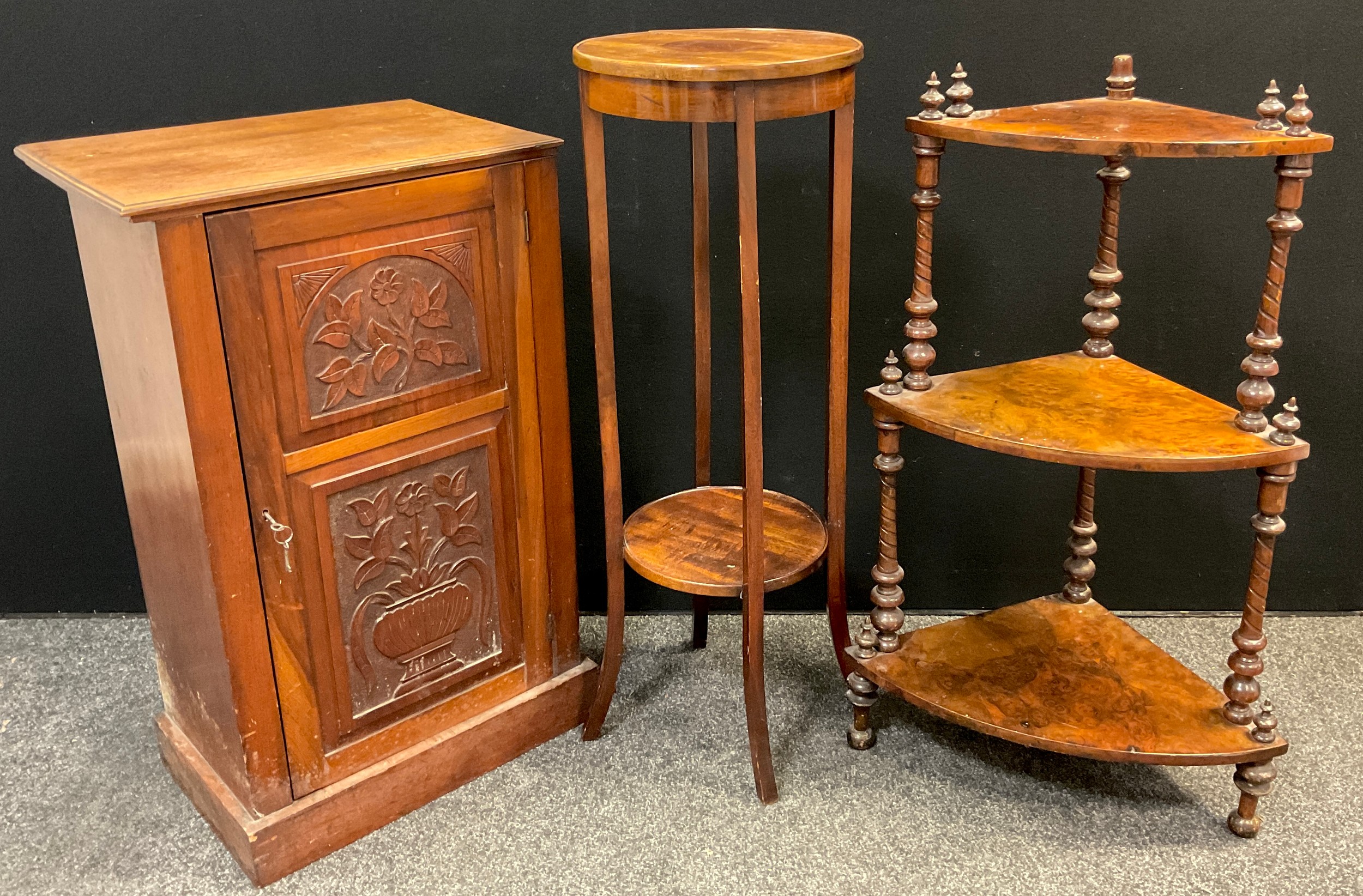 An early 20th century walnut side cabinet, carved door, 88cm high x 54.5cm wide x 37.5cm deep; a