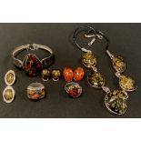 A Copal amber five panel necklace, silver coloured metal mounts, unmarked; similar bangle, stamped