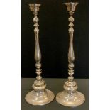 A Pair of large steel candlesticks, 64cm high