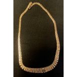 A 9ct gold three colour textured fancy link necklace, stamped 375, 41cm long, 24.3g