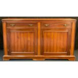 An Edwardian mahogany sideboard, pair of drawers to frieze, above two large cupboard doors, 87cm