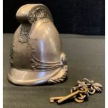 A novelty Fireman's helmet money bank with key