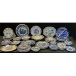 A quantity of blue and white tableware including bowls, plates and dishes; etc