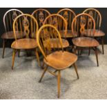 A set of eight Ercol Elm Fleur-de-lys design dining chairs, (8).