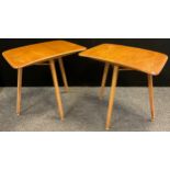 A pair of Ercol, ‘Blonde’ Elm, mid century tripod desk tables (also designed to be used as extension