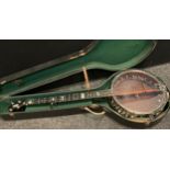 A Remo Weatherking five string banjo, cased.