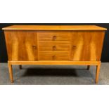 A mid 20th century Gordon Russell for Heals walnut sideboard, designed by W H Russell for Russells