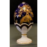 A Royal Crown Derby limited edition Paradise Egg on stand, cobalt Blue, gold stopper, 962/3500, with