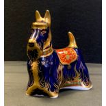 A Royal Crown Derby paperweight, Scottish Terrier, 14cm long, gold stopper, red printed marks.