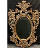 Interior design - A large rococo style or ‘Belle Epoque’ wall mirror, bevelled oval plate, within an