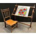 A late 19th century oak bobbin turned nursing chair, studded leather seat, shaped and turned body,