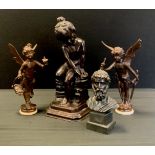 A Bronze sculpture of a child sat on a rock, 32cm high, a bronze cupid and fairy, 24cm high;