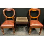 A pair of Victorian mahogany balloon-back chairs, leather drop-in seats, turned legs, 89cm high;