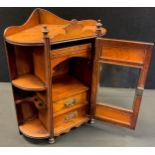 A Victorian walnut and oak smoker's cabinet, galleried back, single glazed door to centre, enclosing