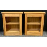 A pair of bijou light oak bookcases, each with single shelf, measuring 67cm x 27cm x 78.5cm, (2).