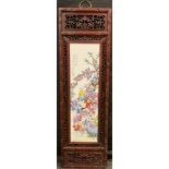 Interior Design - A reproduction Chinese Famille Rose style porcelain wall plaque, mounted in a