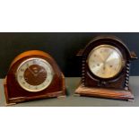 An early 20th century oak cased mantel clock, silvered brass dial, Arabic numerals, twin winding