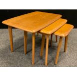 A Danish design nest of three teak side tables, by Priory furniture, the largest 45.5cm high x
