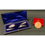 A cased christening set, fork and spoon, London 1904, 46g; 1902 Edward VII coronation medal,