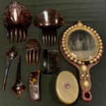 A Victorian chatoyant quartz mounted hand mirror, faux Tortoiseshell hair clips, etc