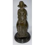 Chiparus, after, a bronze sculture, of a young lady holding a book, circular composite marble