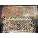 A Middle Eastern woollen rug or carpet, geometric motifs in tones of red, green and blue, 224cm x