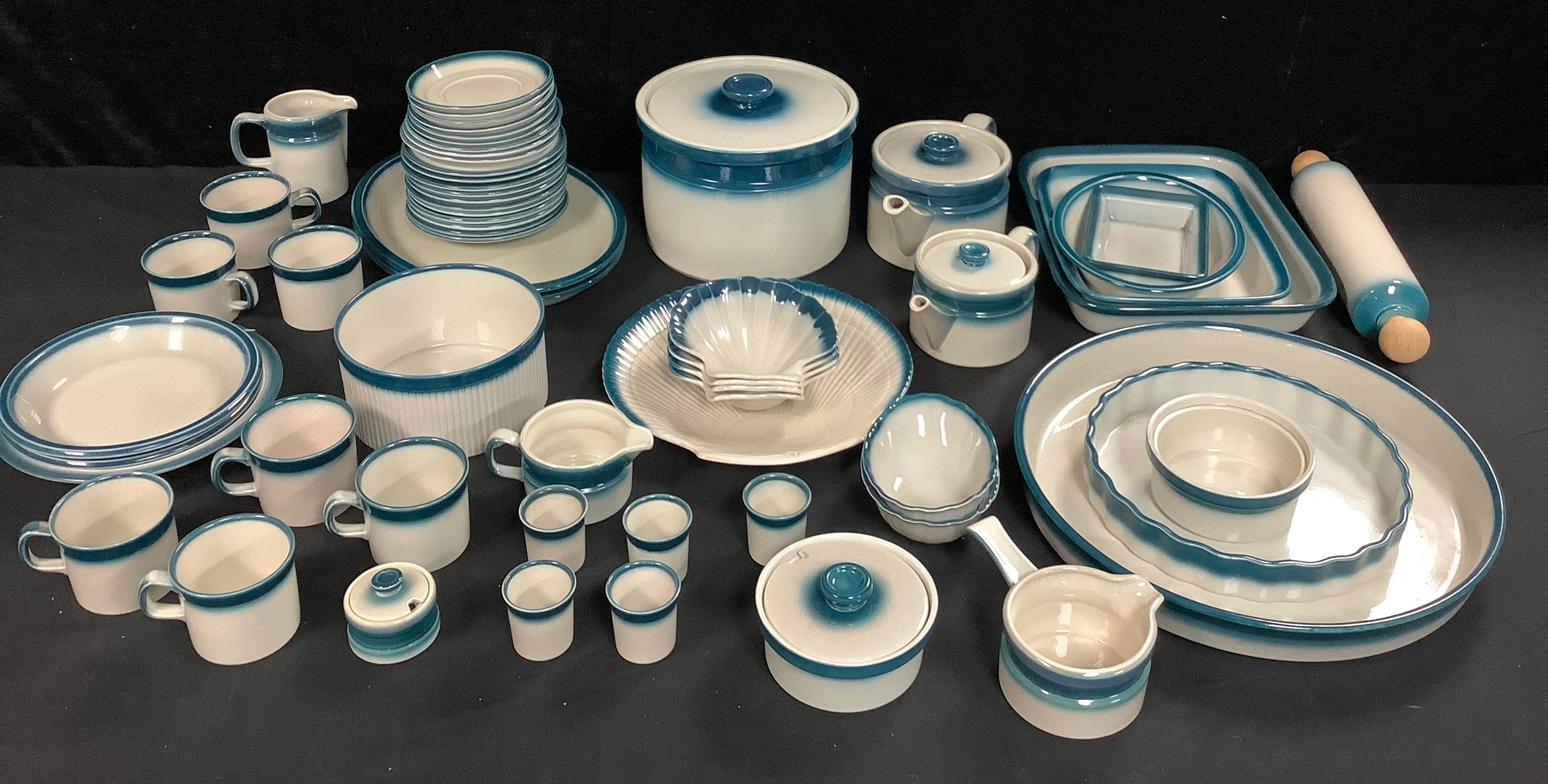 A Wedgwood Blue Pacific pattern dinner and kitchen ware service, including two teapots, scallop