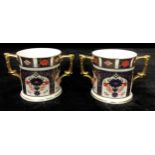 A pair of Royal Crown Derby Imari 1128 pattern two handled loving cups, first quality, 7.5cm