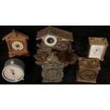 A wooden musical clock, modelled as a mill, 17cm high; carriage clocks, etc (6)