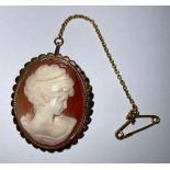 A 9ct gold carved shell cameo brooch, marked 375, 3cm, safety chain, 6g, boxed