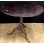 A George III mahogany birdcage tripod occasional table, circular tilting top, knopped column,