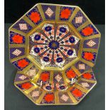 A pair of Royal Crown Derby Imari 1128 pattern octagonal plates, solid gold band, 22cm wide, first