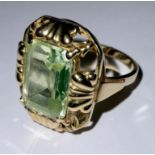 A gold dress ring, set with a single faceted green spinel, size Q, unmarked, 6g