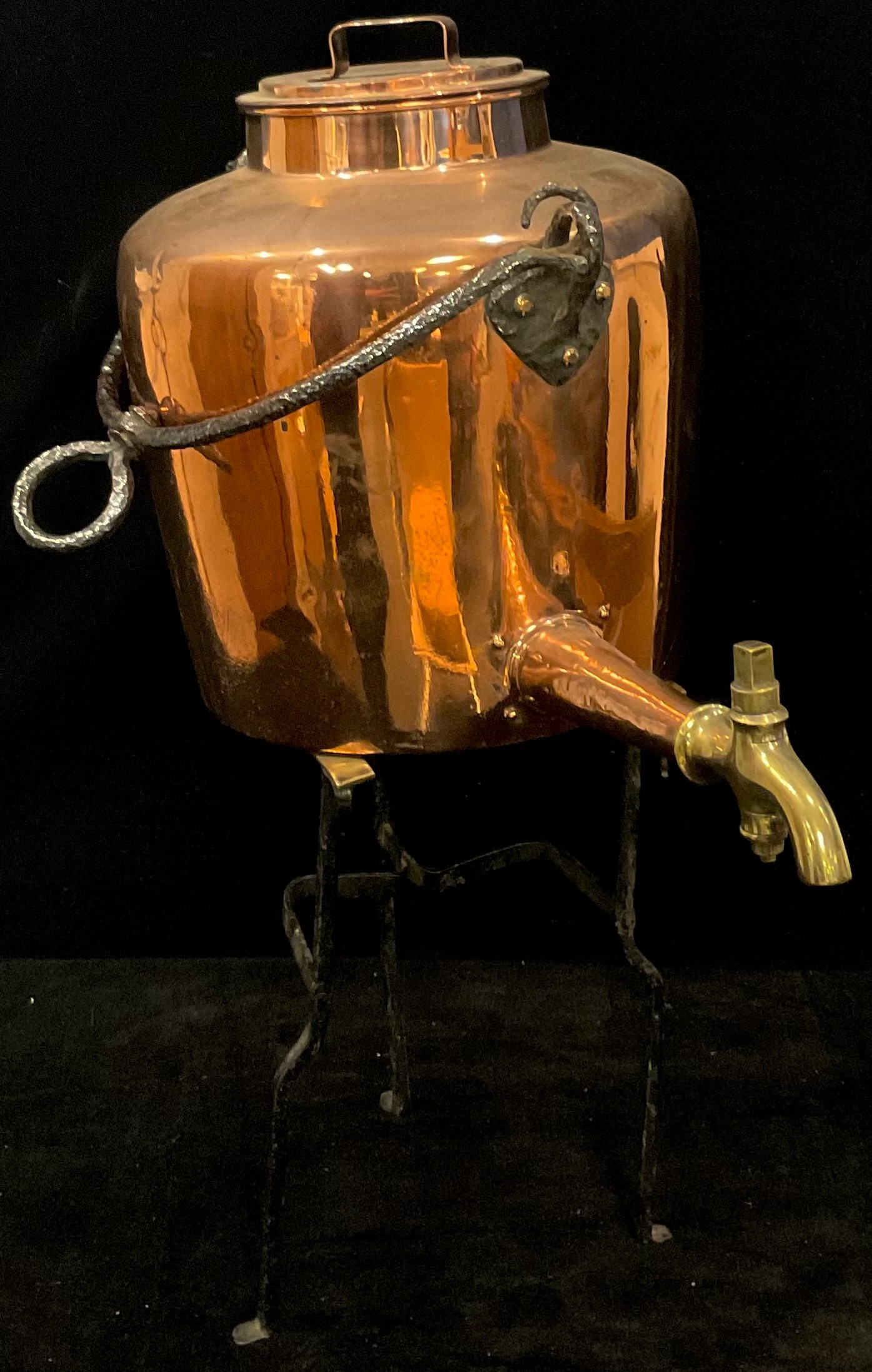 A Victorian copper gypsy kettle, 48cm over iron suspension handle; a Georgian brass and iron