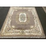A large woollen rug or carpet, stylised flowers and scrolls in muted tones, 459cm x 367cm