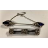 An Art Deco style scarf or cape pin, set with paste blue and white stones, 8cm, safety chain,