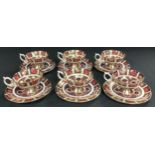 A set of six Royal Crown Derby Imari 1128 pattern teacups, saucers and tea plates, first quality,