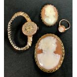 A 9ct gold carved shell cameo ring, size N, 2g; a 9t gold carved shell cameo brooch. 9.6g; a lady'