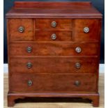 A George III Revival mahogany chest of drawers, by Waring & Gillow, stamped to the locks, c.1925,