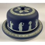 A Wedgwood Jasperware cheese dome and cover, typically sprigged with classical muses and cupids, the