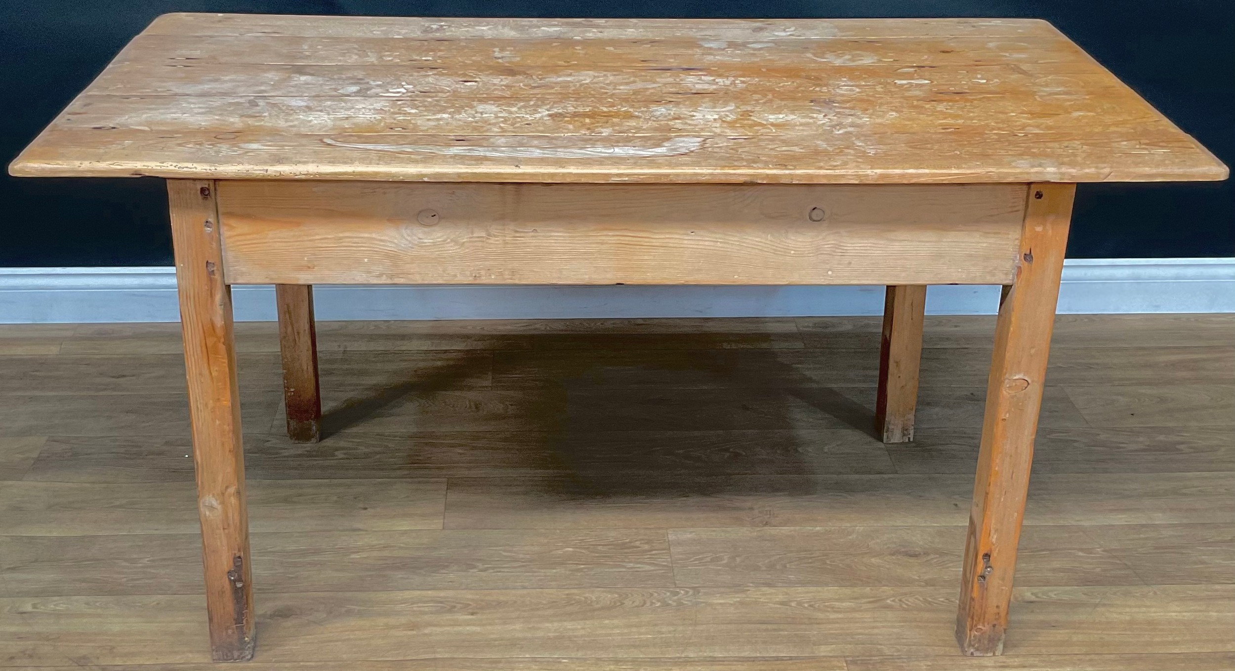 A pine farmhouse kitchen table, 75cm high, 147cm wide, 77cm deep