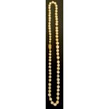 A pearl necklace, gold coloured metal clasp