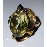 A 9ct gold dress ring, set with a large faceted oval citrine, size M, 8g