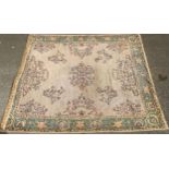 A large Middle Eastern woollen rug or carpet, stylised floral motifs, 385cm x 312cm