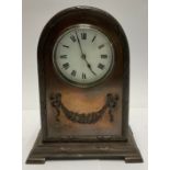 A French bronzed metal dome topped mantel timepiece, Roman numerals on white dial, bronzed metal