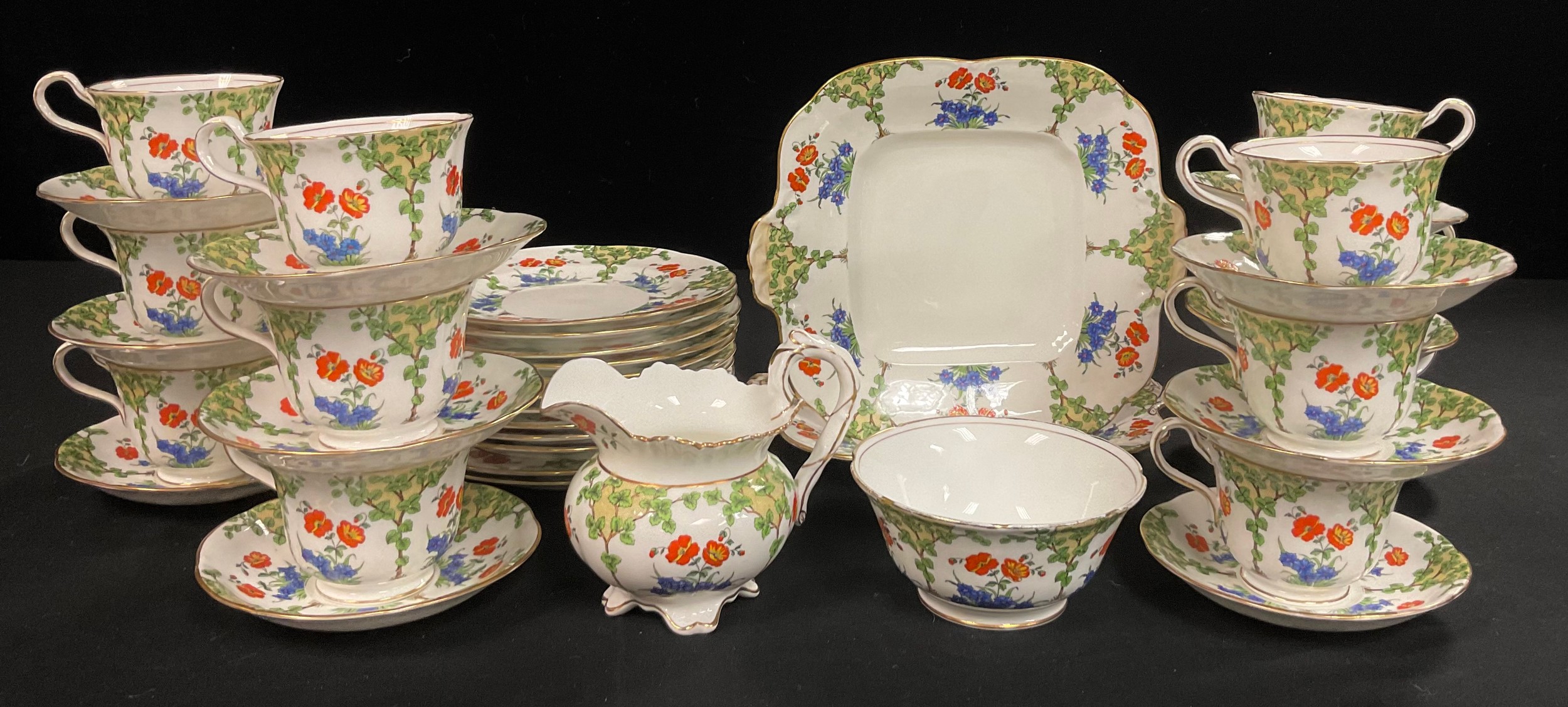 An early 20th century Aynsley tea set, comprising twelve teacups, saucers and tea plates, pair of